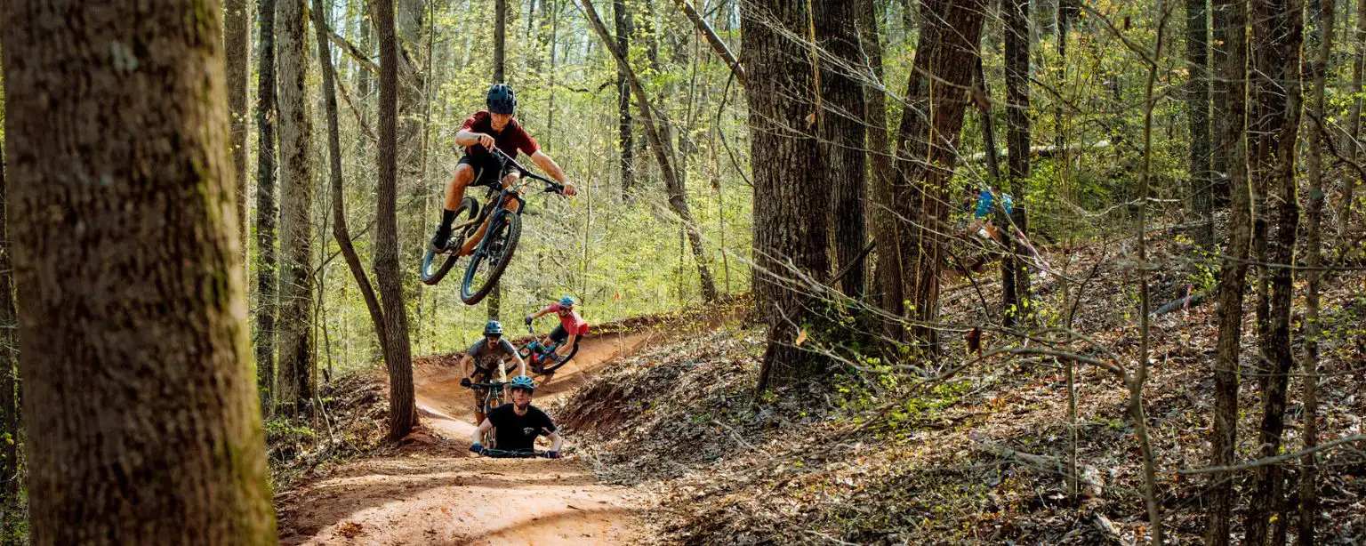 A mountain biker catching some air on Tennessee mountain biking trails