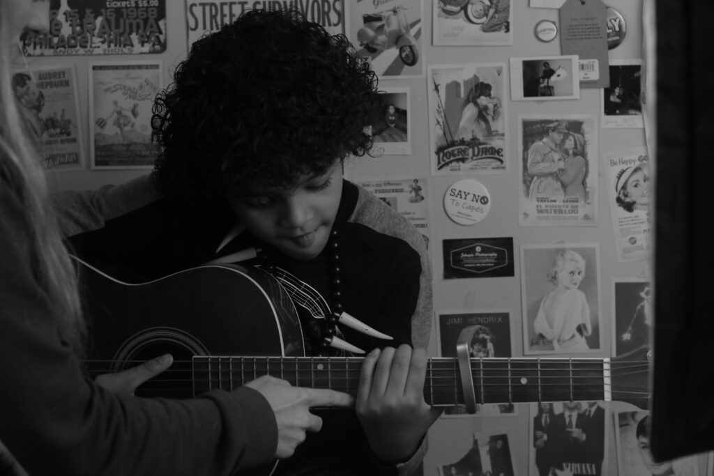 A child plays the guitar 