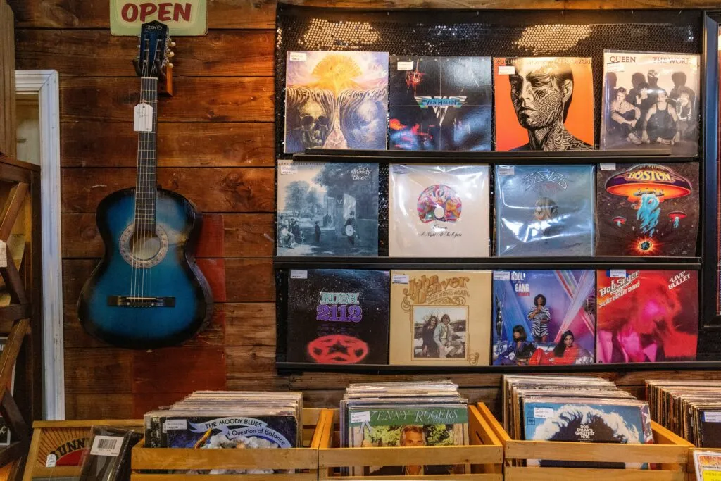 Rows of records sitting along a wall 