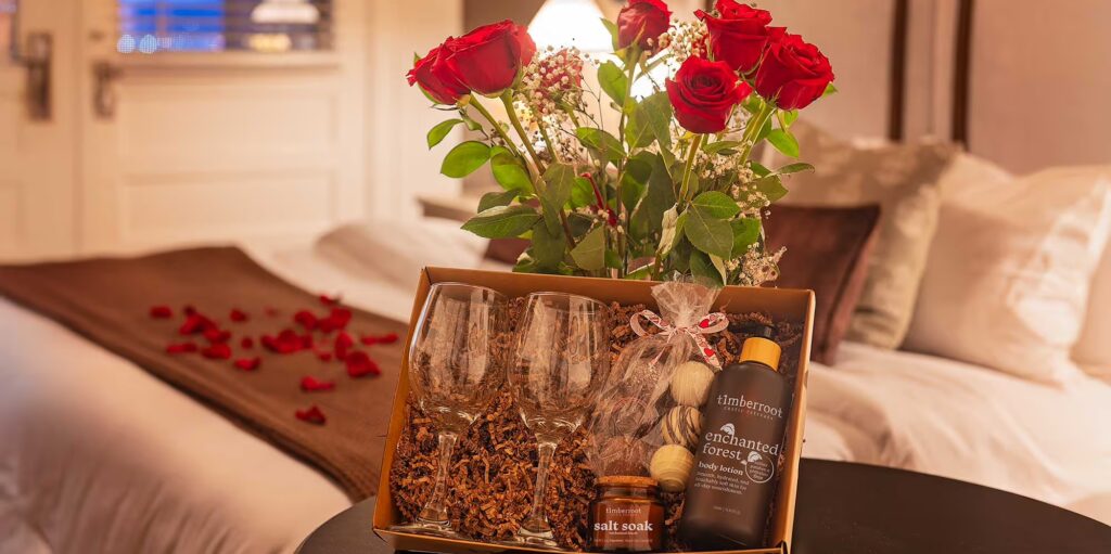 romance package with roses, body lotion, soaking salts, chocolate and wine