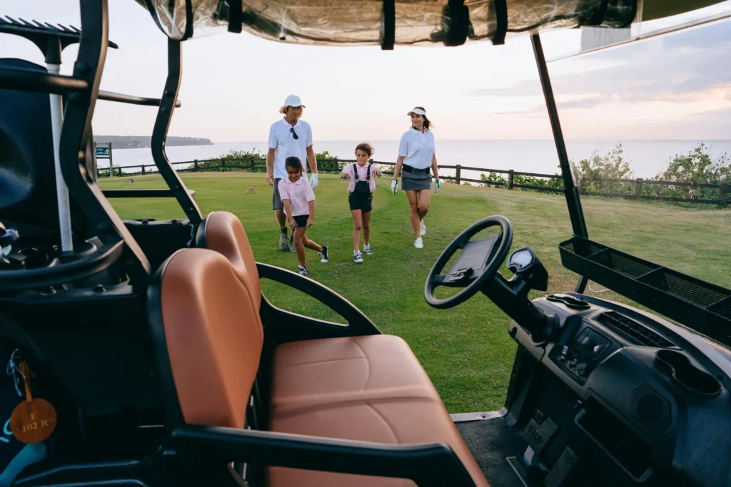 A family enjoying a round of Golf