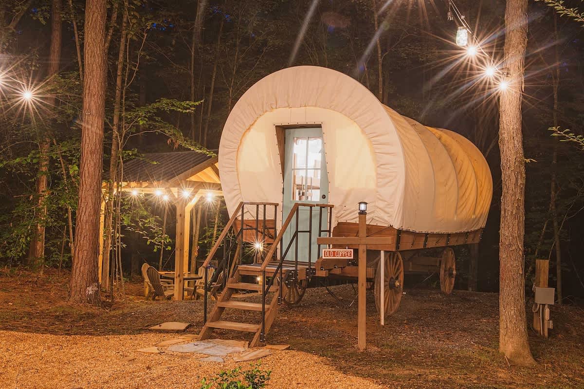 Pioneer covered-wagon glamping at Welcome Valley Village