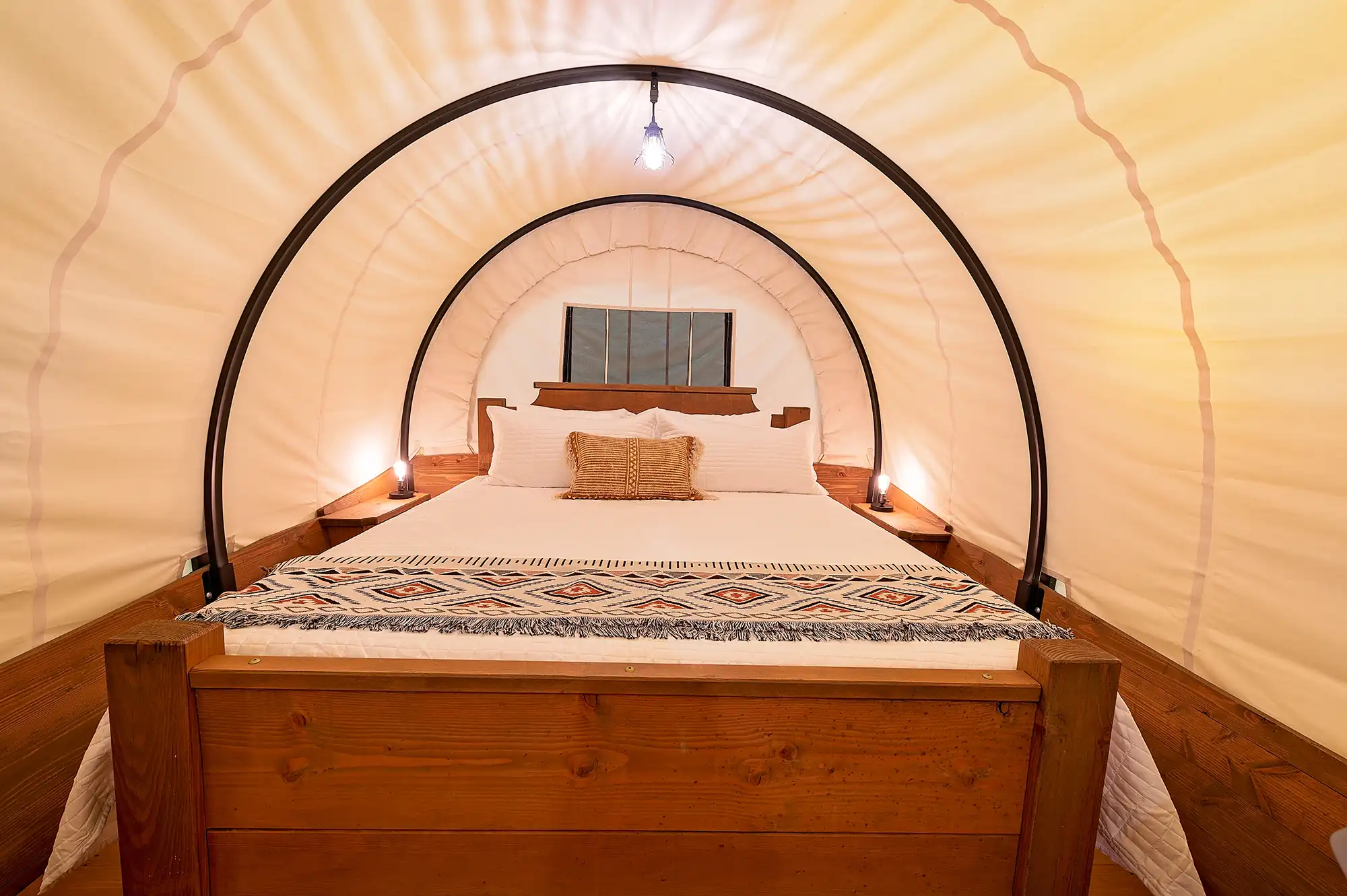 old copper camping wagon king bed